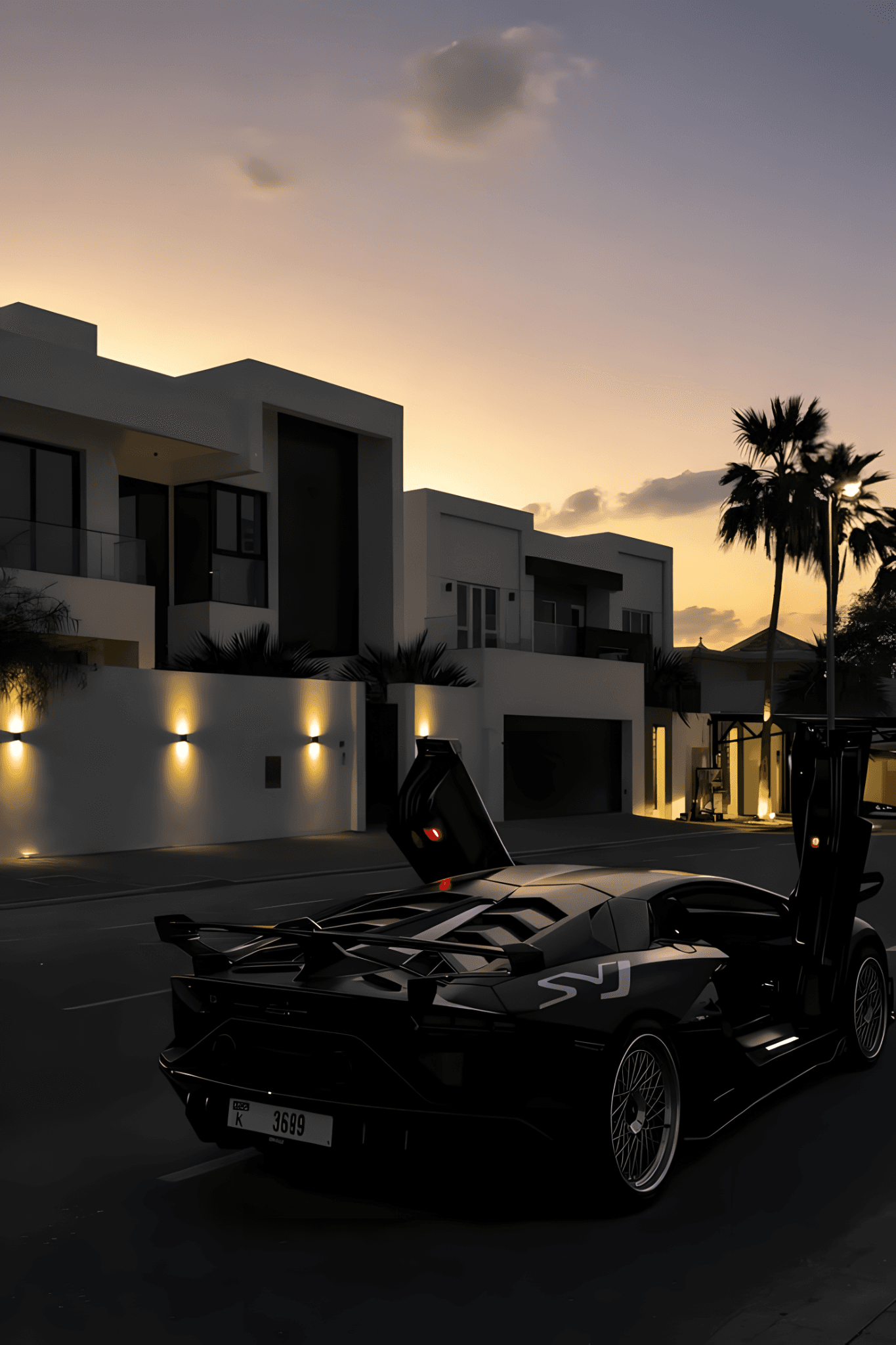 Voiture de sport noire devant une villa contemporaine au coucher du soleil